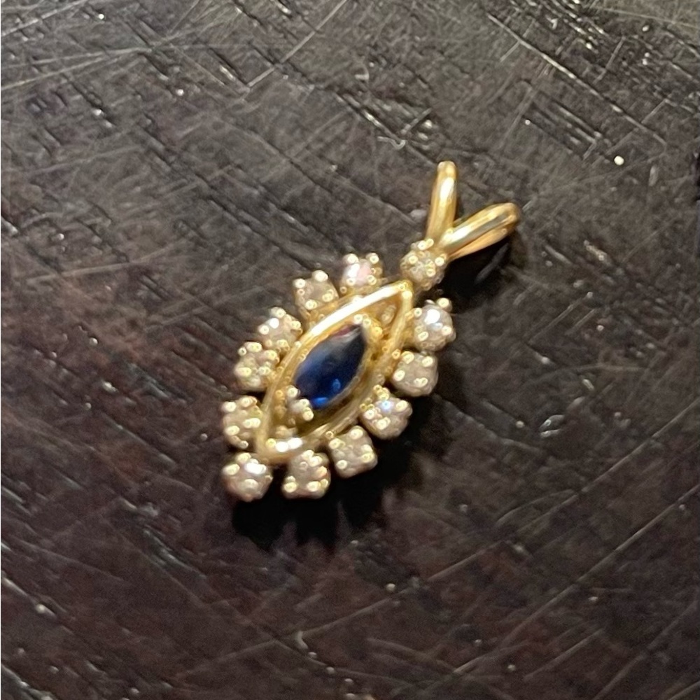 14K gold (1.22grams) with Marquis blue sapphire  and 12 diamonds (real stones)